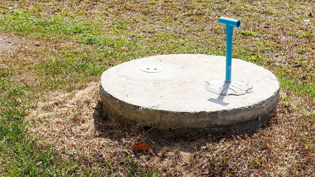 underground cement cylinder of lavatory cesspit in lawn yard