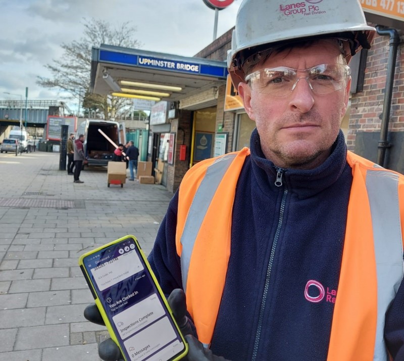 Lanes Rail Team Leader James Gooch with his Team Leaf enabled phone. Helping him and his colleagues carry out maintenance across the London Underground network.